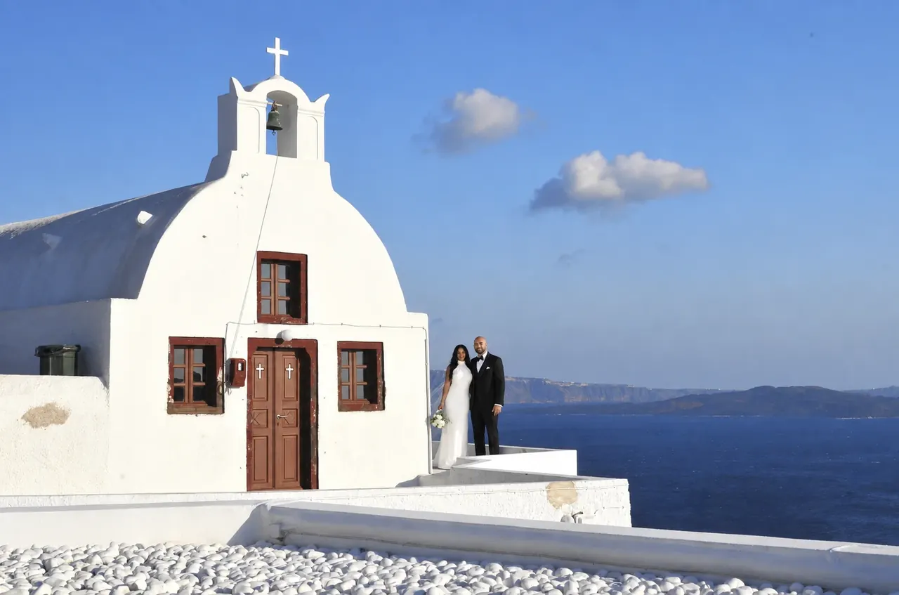 Salina and Samuel by a chapel above the sea